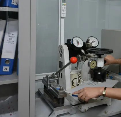 Bursting strength test on a Mullen-type tester in the QC lab