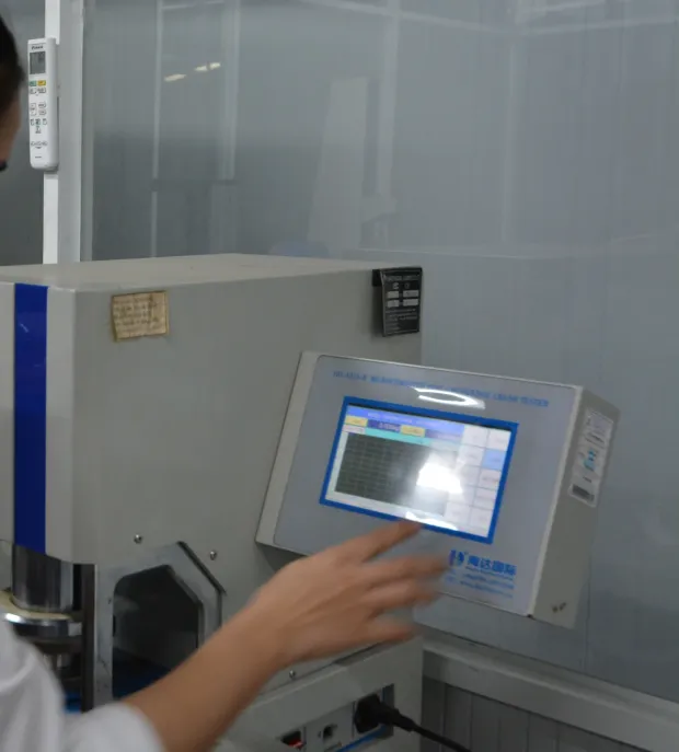 Running a sample test on a digital tester in the Minh Phuc QC lab